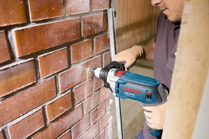 BOSCH GSB 16 RE Mașină de găurit cu percuție 750 W + Valiză — 2